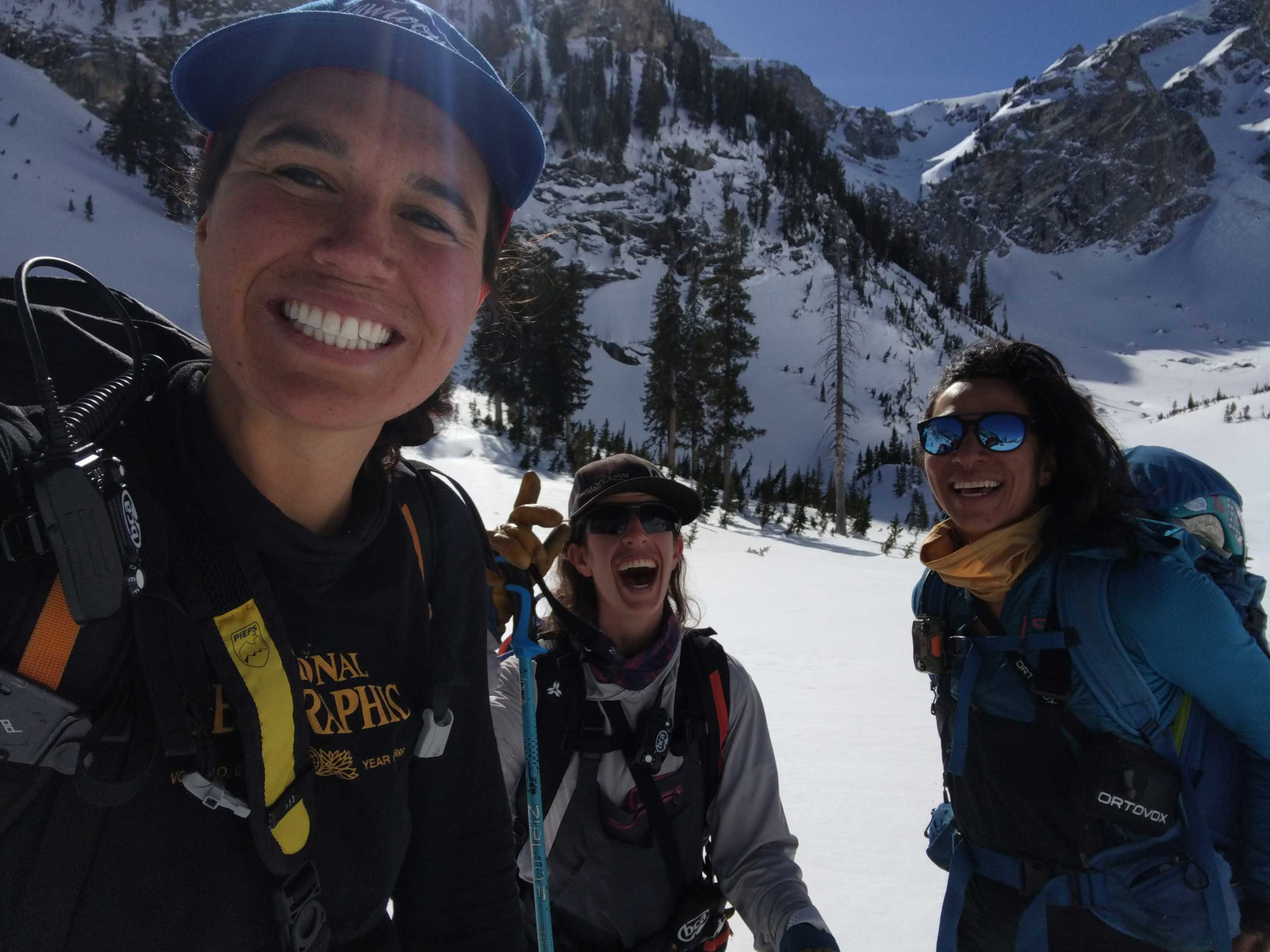 Sofia Jaramillo-Sophia Schwartz and Dani Reyes-Acosta gleefully pose after skiing an expert couloir in Grand Teton National Park