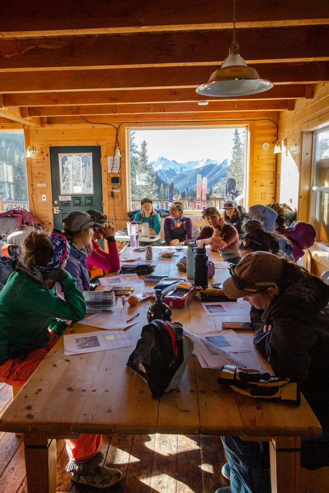 Women-backcountry-skiers-splitboarders-discuss-terrain-San-Juans-Julia Ordog Photo-Guides Erin Laine Sarah Macgregor-Equanimity Outdoors Lead Dani Reyes-Acosta.